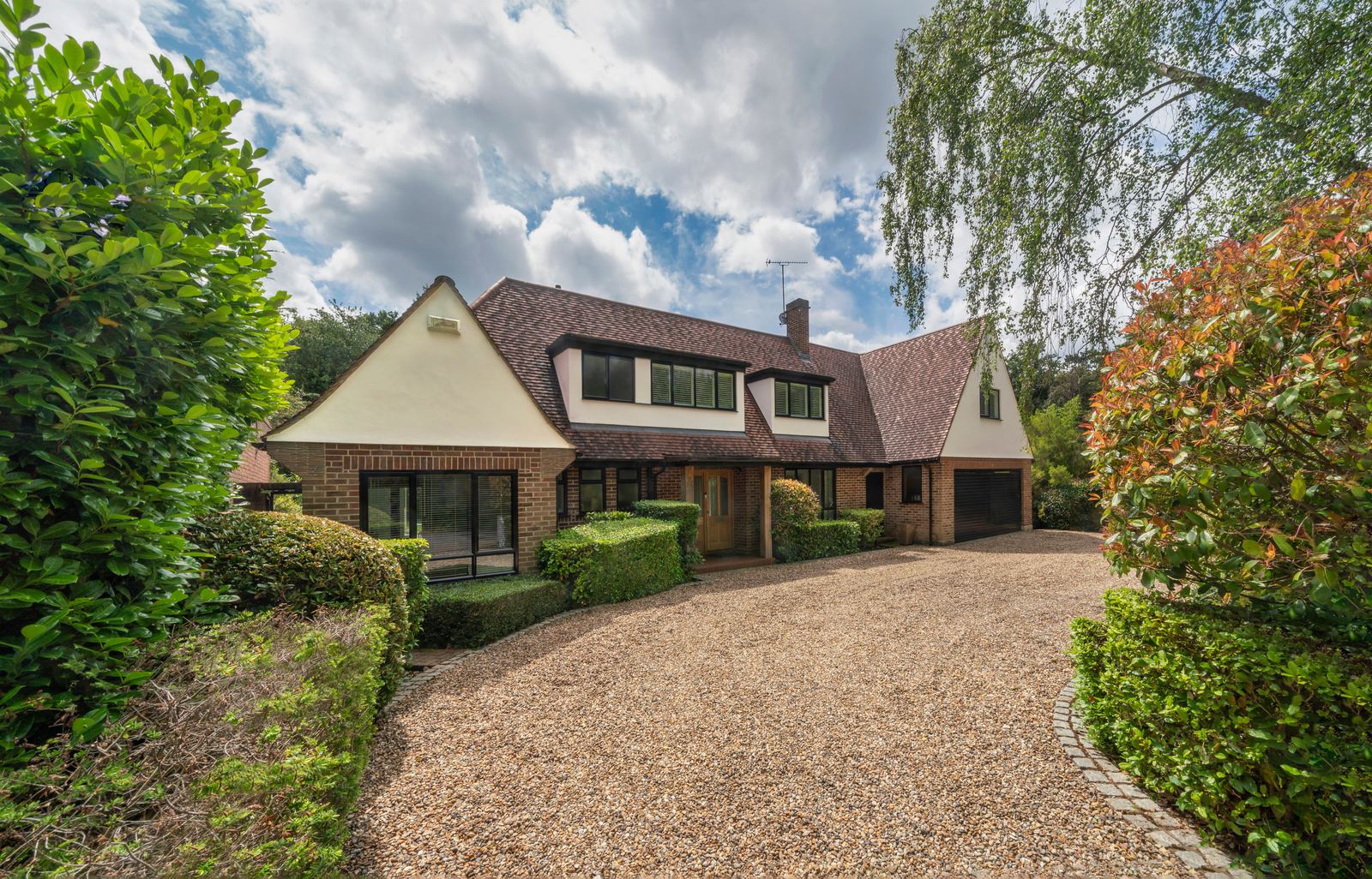 Plain clay tiled roof of a large detached house