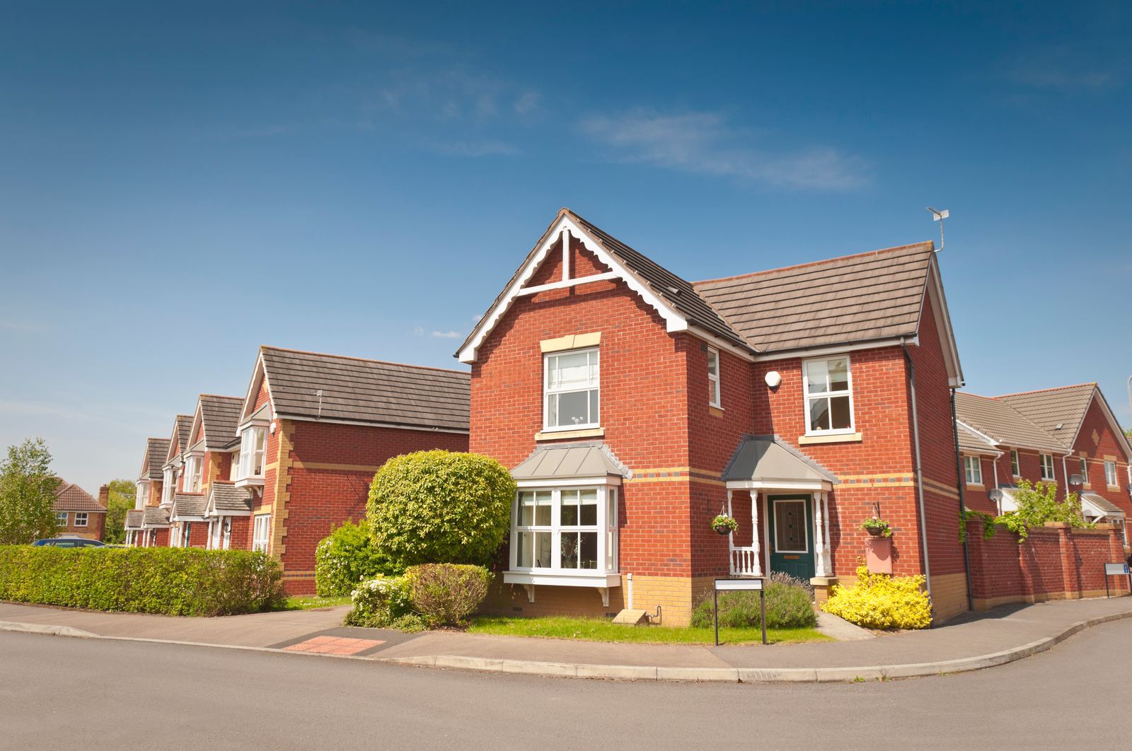 Detached home with bay and roofline detail